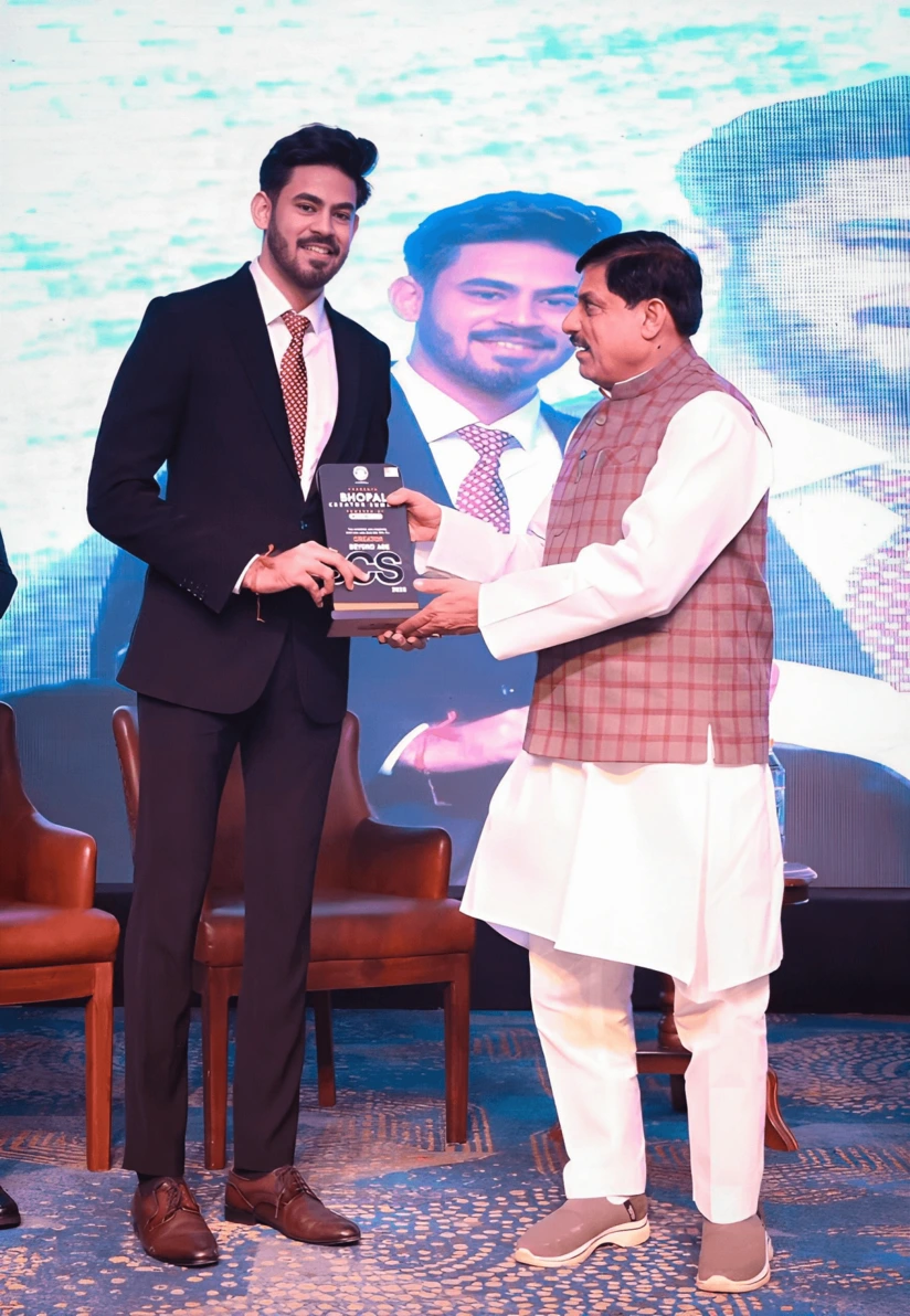 Aryan Tripathi receiving the award from Hon. Chief Minister Dr. Mohan Yadav